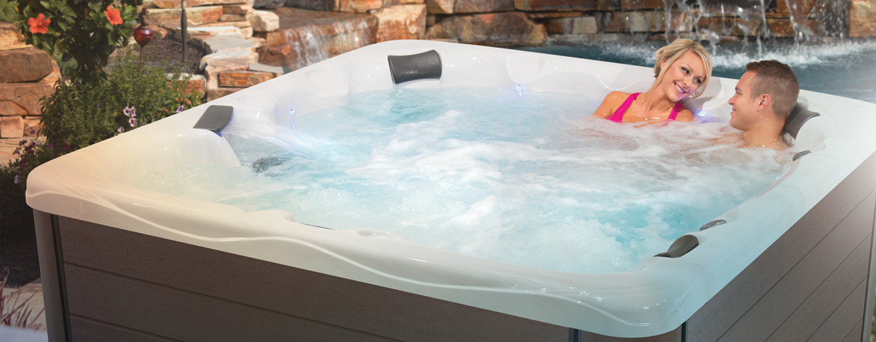 Clarity Spas hot tub on patio by pool